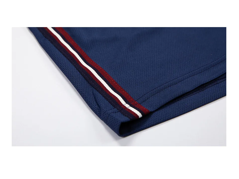 Close-up of the fabric and side stripe detail on the athletic shorts.