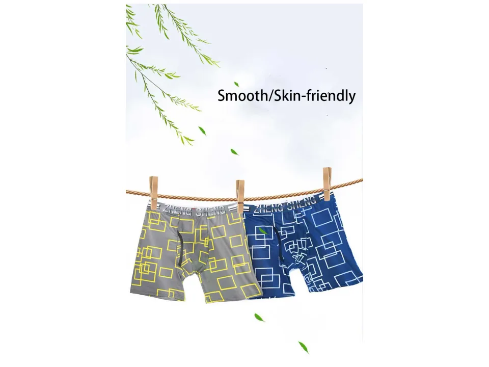 Two pairs of patterned boxer briefs hanging on a clothesline.