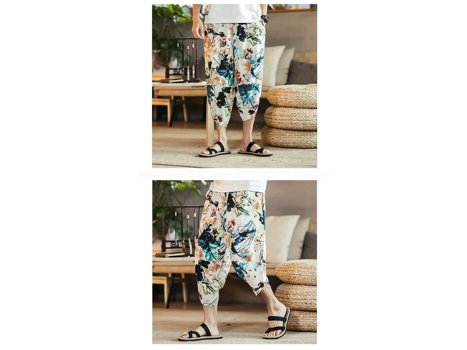 A man wearing loose, patterned cropped pants in a casual setting.
