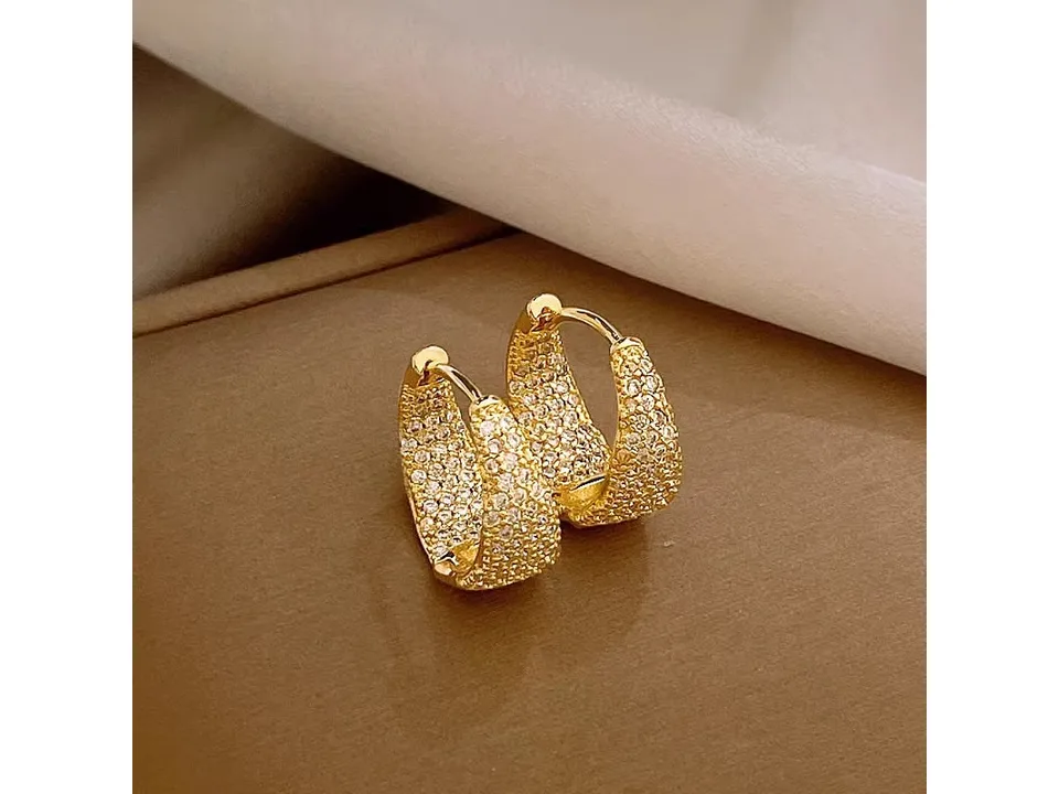 A pair of gold-tone geometric hoop earrings encrusted with cubic zirconia.