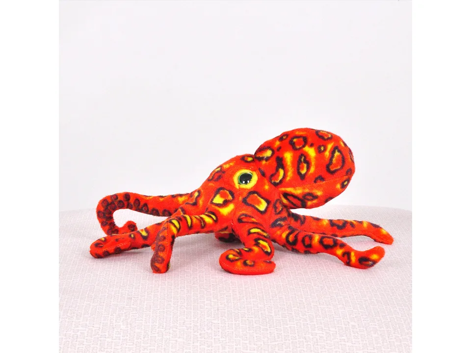 Orange leopard print octopus plush toy viewed from the side.