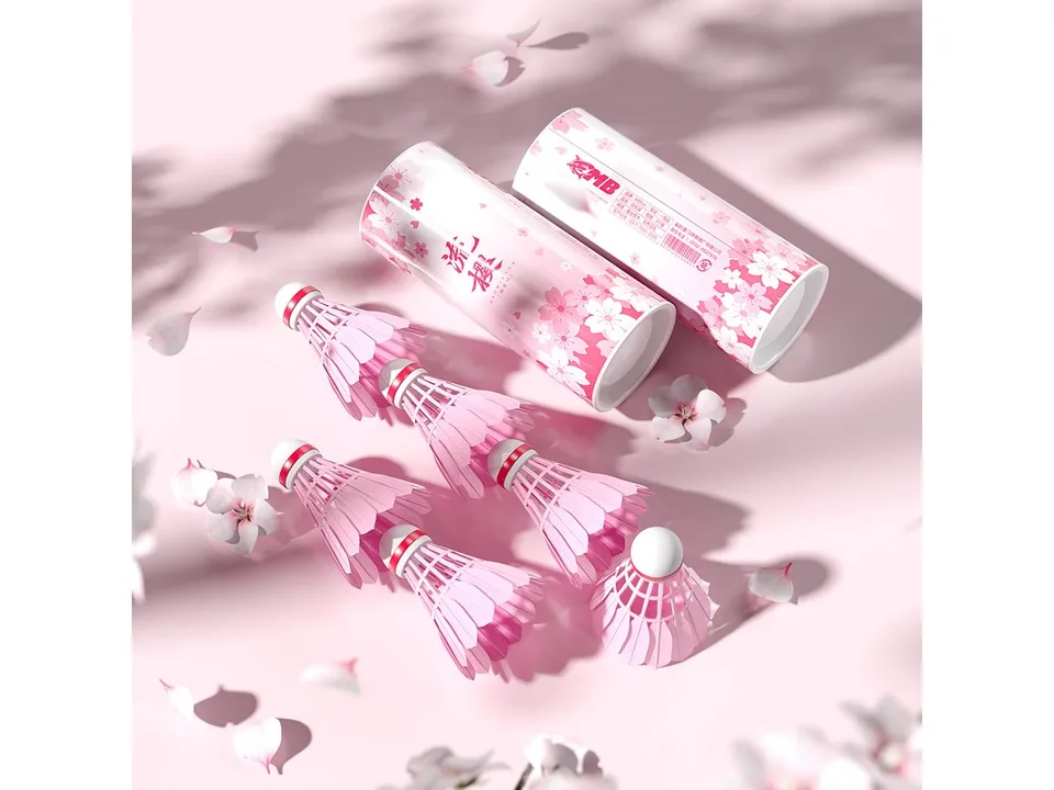 Pink cherry blossom badminton shuttlecocks and their cylindrical packaging.