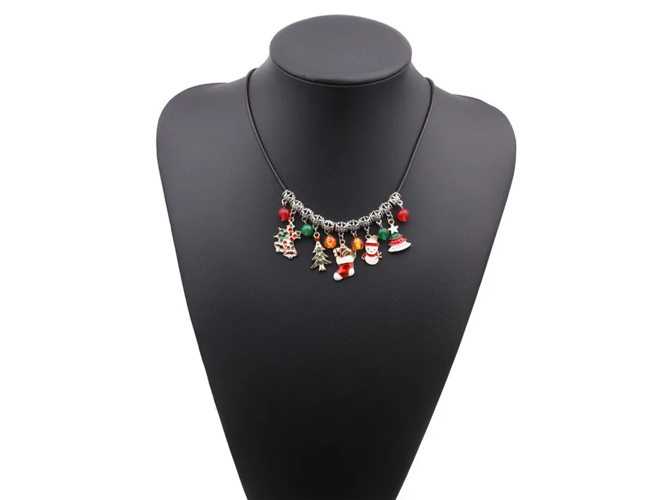 Christmas charm necklace displayed on a black mannequin bust.