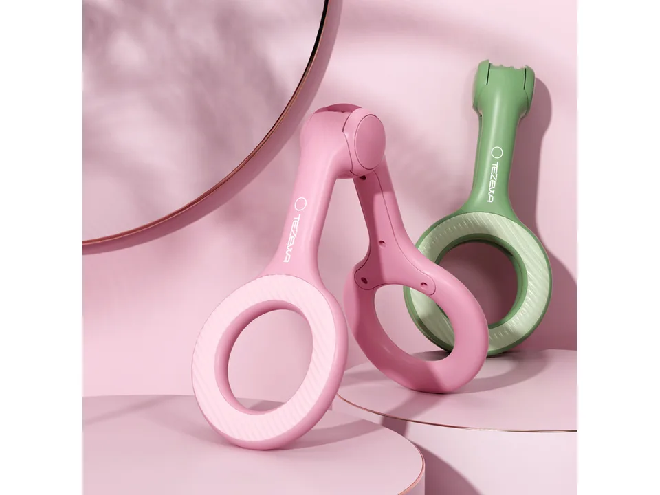 Pink and green pelvic floor muscle trainers displayed on a pink background.