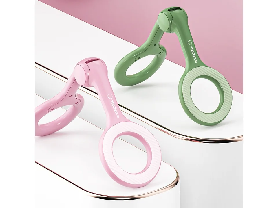 Two pelvic floor muscle trainers, one pink and one green, displayed on a white surface.