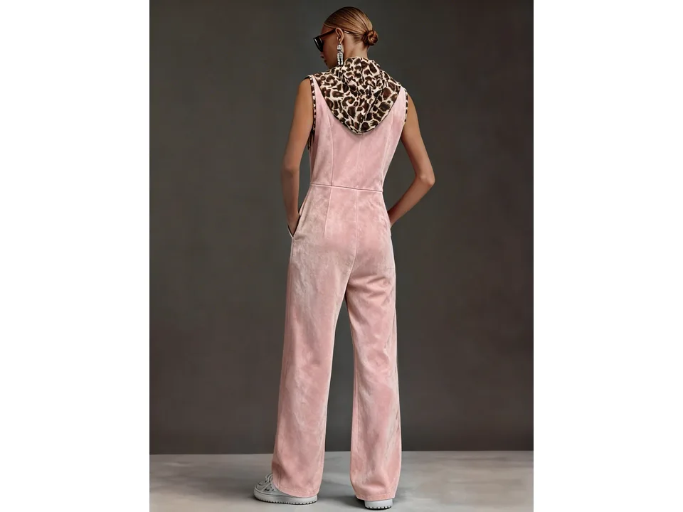 Full-body back view of a model wearing the pink sleeveless hooded jumpsuit.