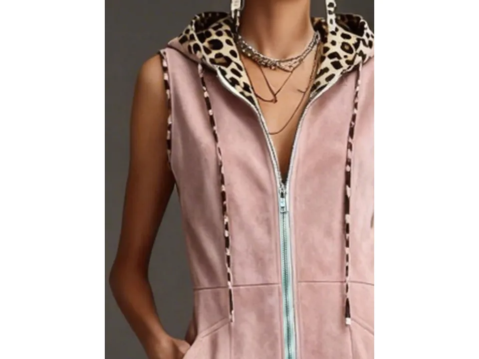 Close-up of the pink jumpsuit showing the leopard print hood lining and front zipper.