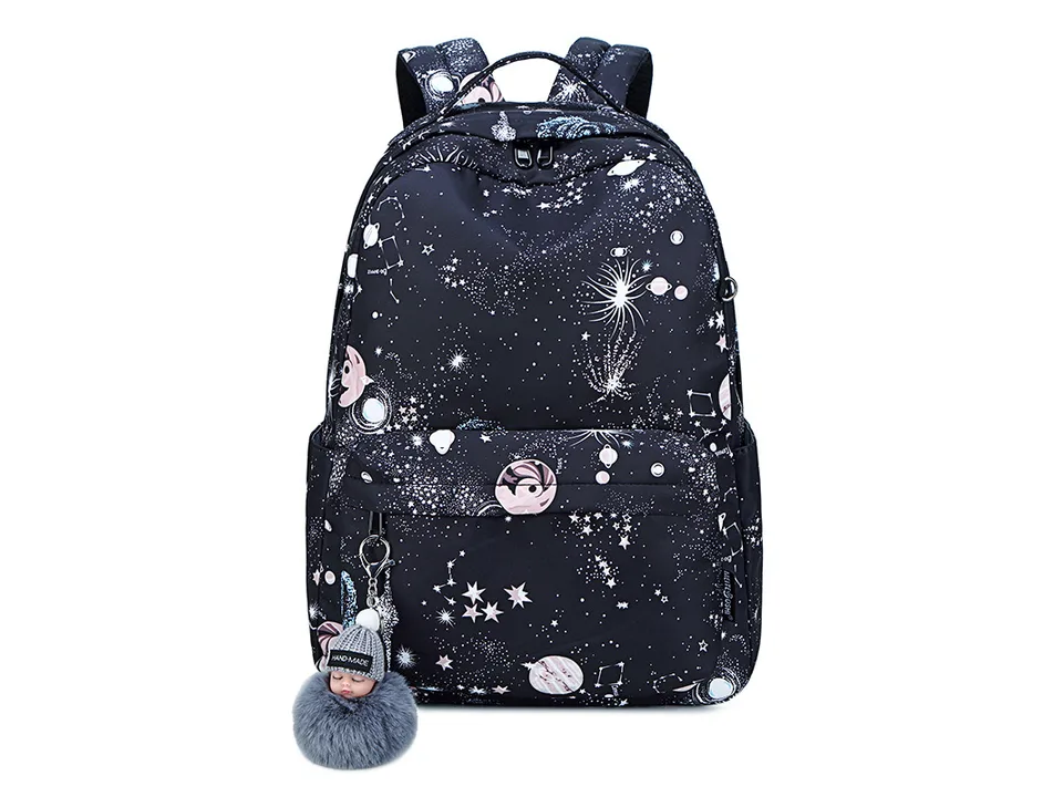 Black galaxy print school backpack with a pom-pom charm.