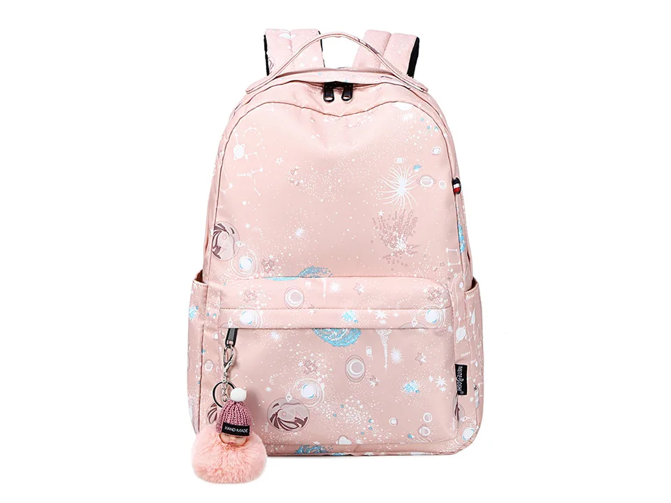 Pink galaxy print school backpack with a pom-pom charm.