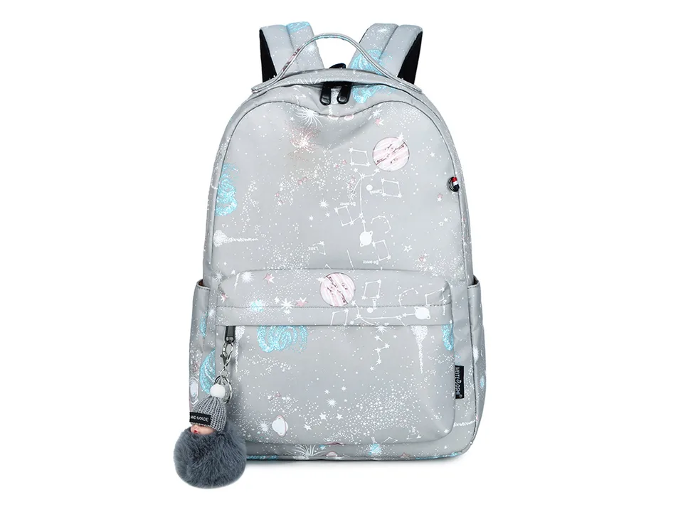 Grey galaxy print school backpack with a pom-pom charm.