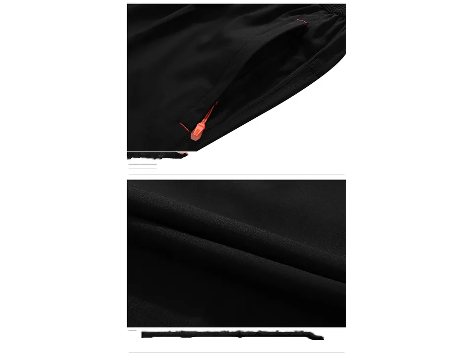 Close-up of the zipper pocket and fabric texture on the black shorts.