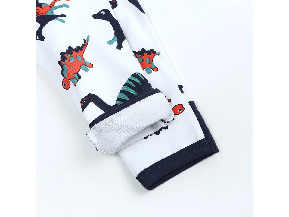 Close-up of the navy blue cuff on the dinosaur print sleeve.