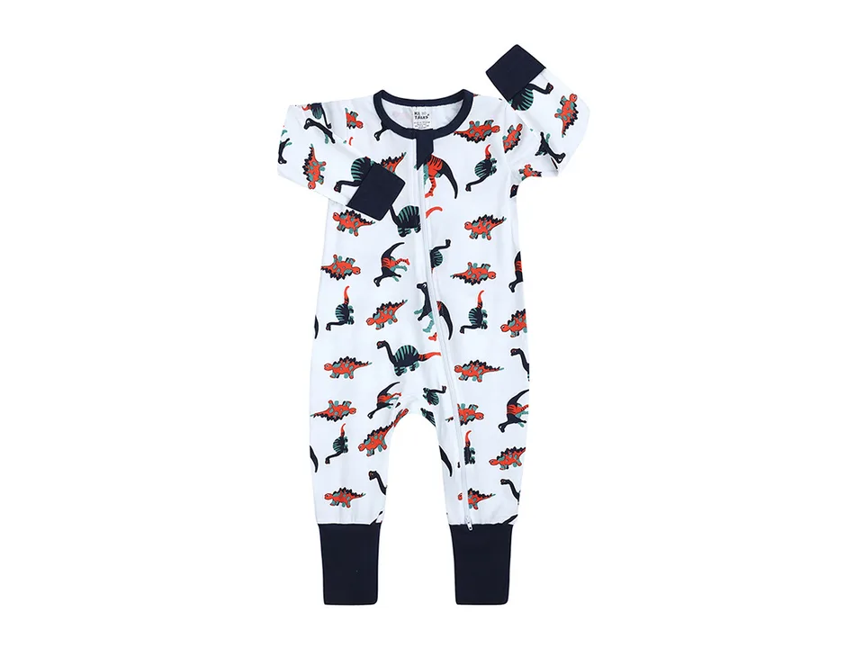 Baby long-sleeved romper with a dinosaur print and navy blue cuffs.