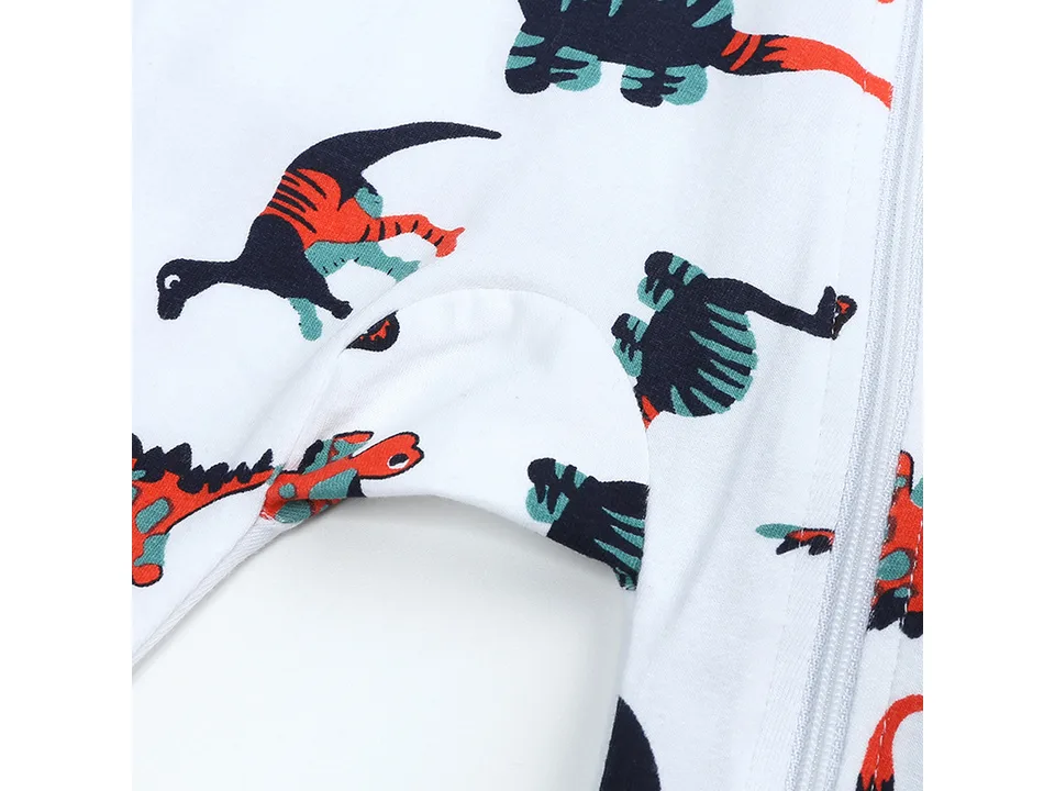 Close-up of the crotch area of the dinosaur print baby romper.