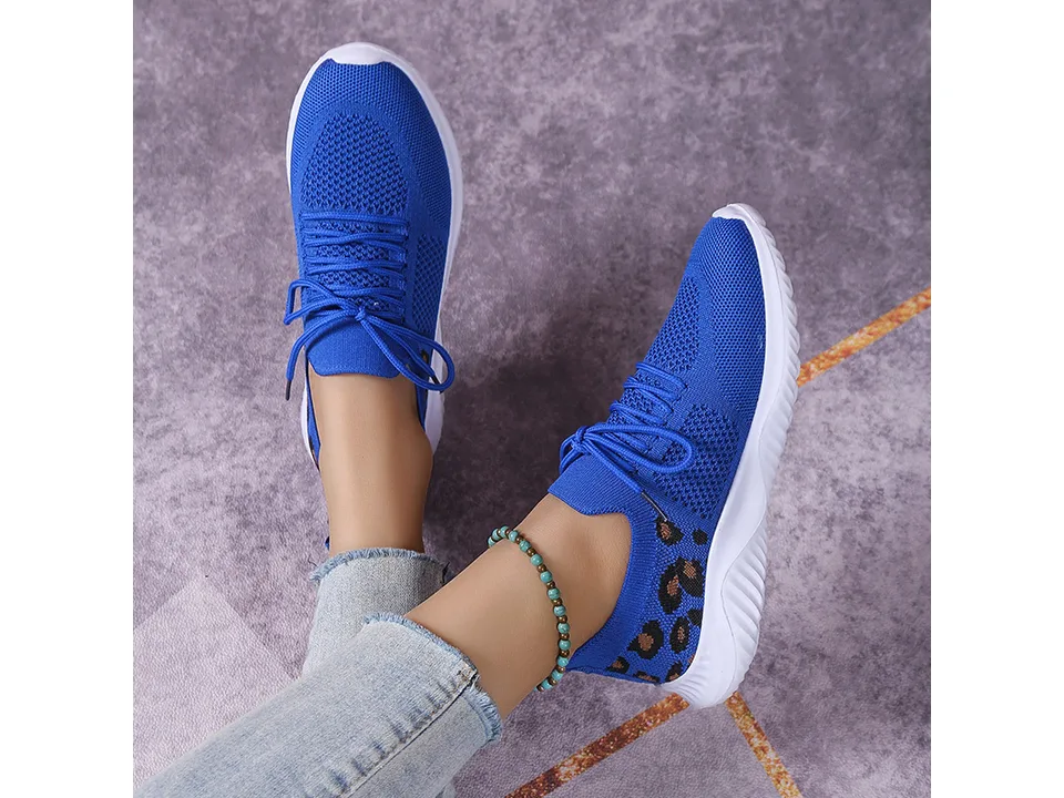 Blue leopard print casual sneakers being worn.