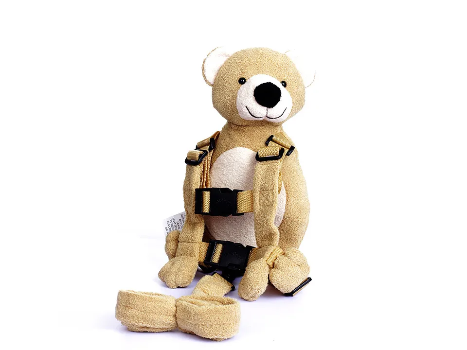 Plush bear backpack with the safety leash attached.