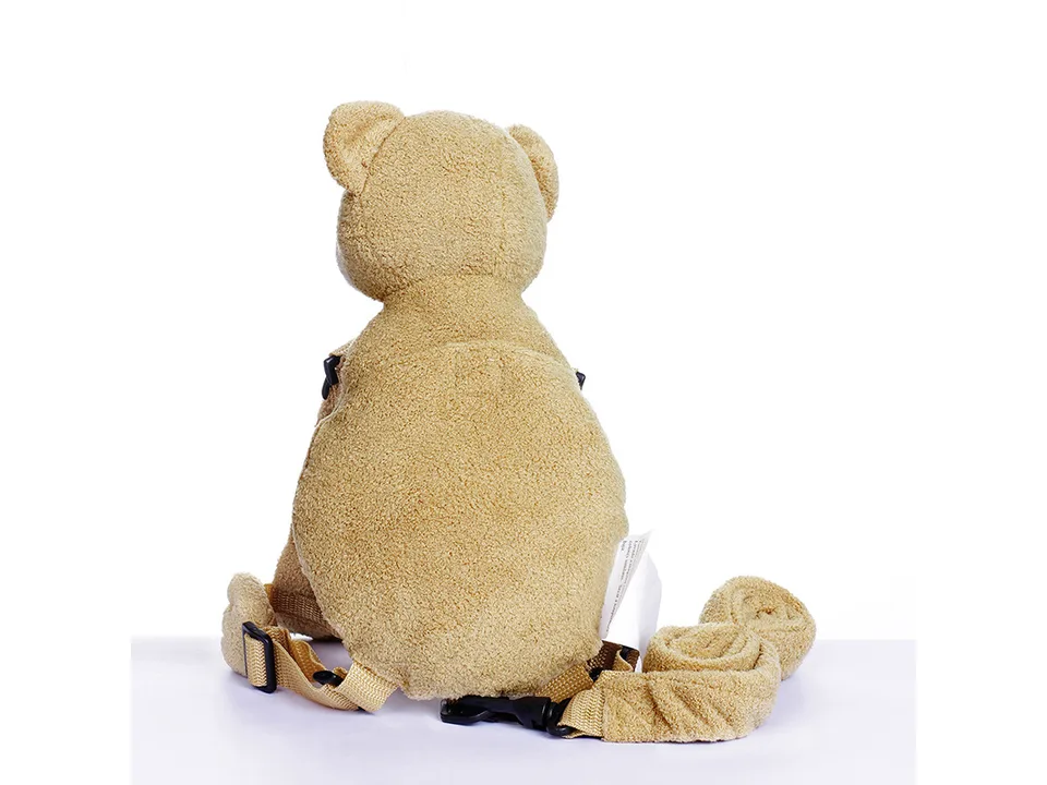 Back view of the plush bear backpack showing the straps and leash.