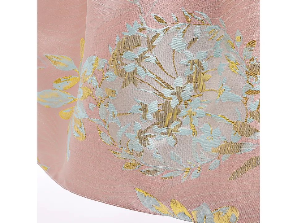 Close-up of the pink floral jacquard fabric pattern.