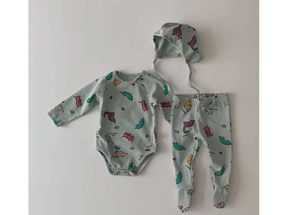 Light blue infant pajama set with matching hat and dinosaur print.