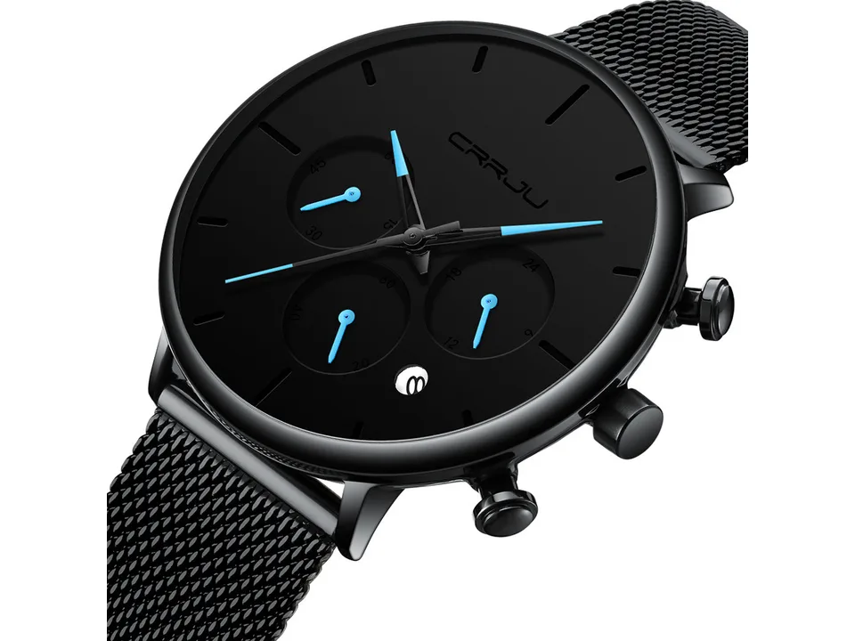 Angled close-up of the black watch face and mesh strap.
