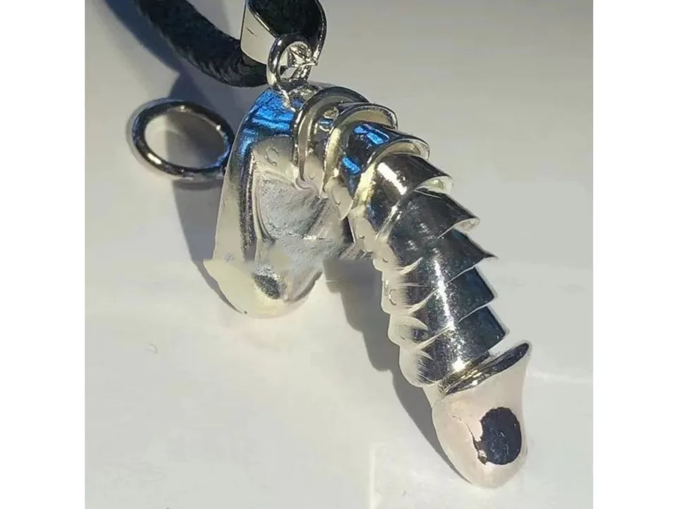 Silver-tone pendant necklace on a black cord.