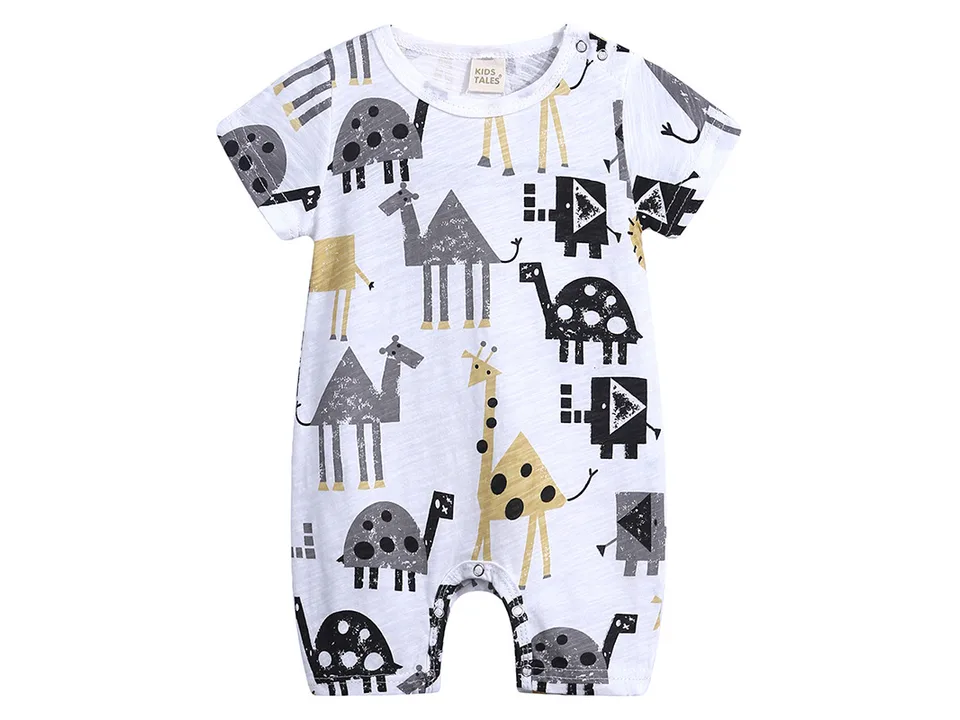 A white baby romper with a pattern of camels, giraffes, and turtles.