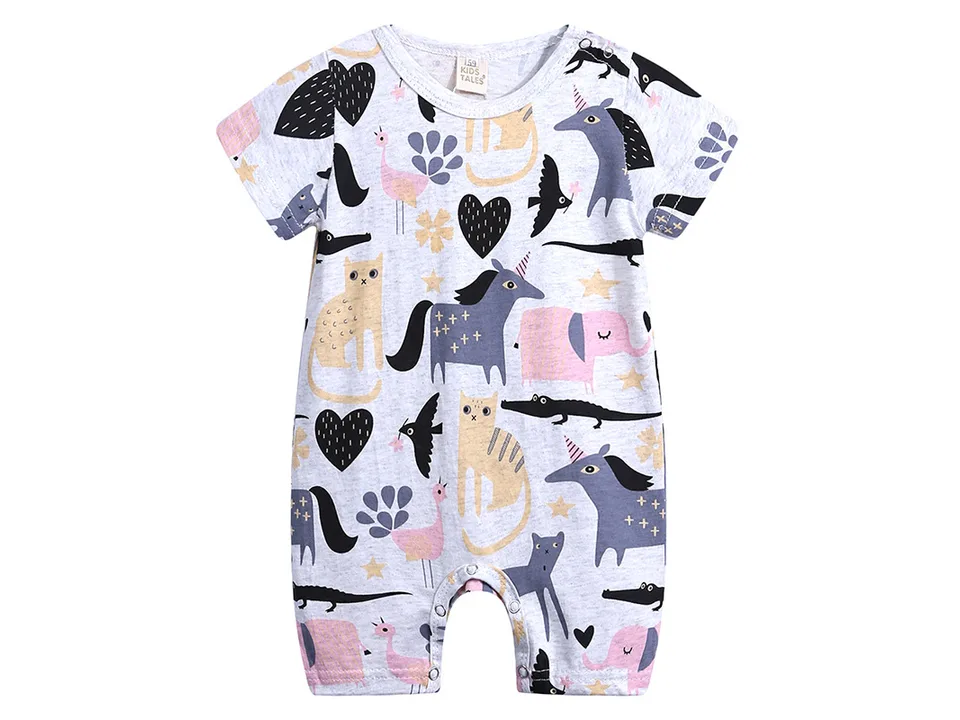 A white baby romper with a pattern of unicorns, cats, and elephants.