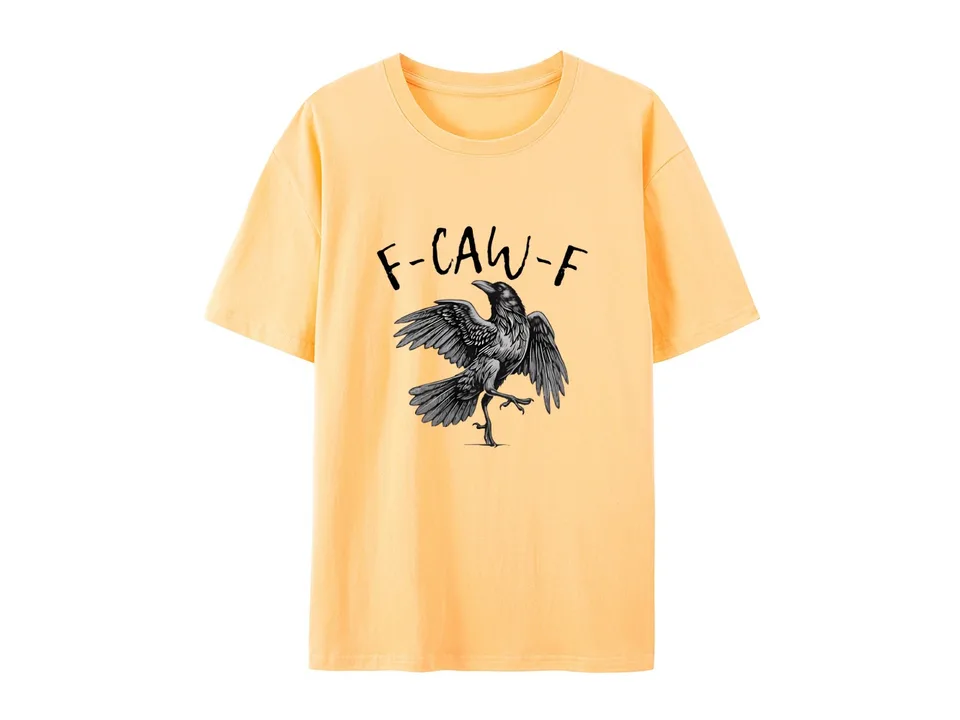 A yellow t-shirt with a graphic print of a crow and the text F-CAW-F.
