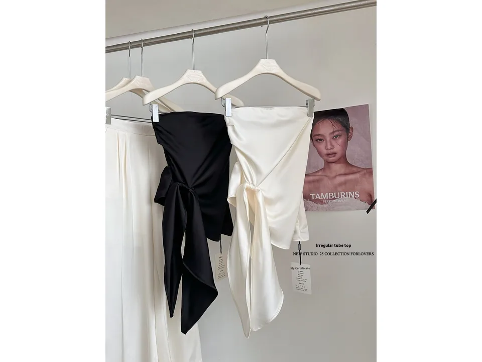 Black and white tube tops hanging on hangers