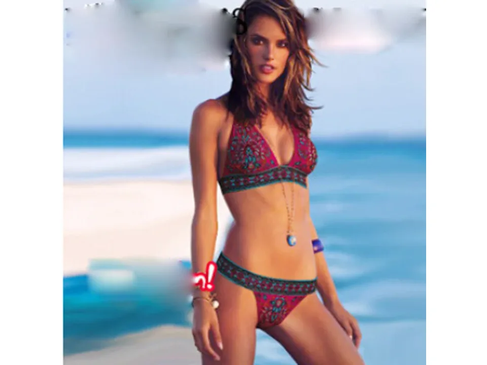 Model wearing the ethnic print bikini set, front view.