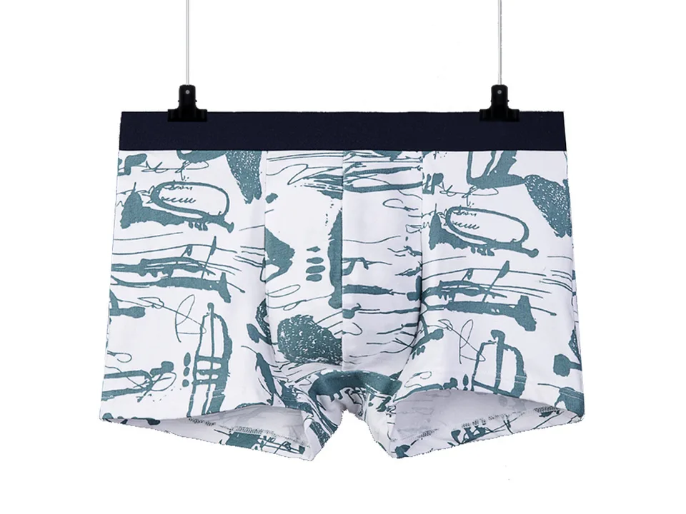 White boxer briefs with a musical instrument pattern hanging on a hanger.