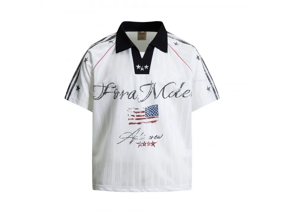 Front view of the white polo shirt with graphic print.