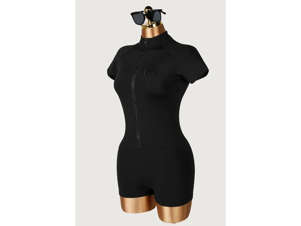 A black yoga jumpsuit on a mannequin.