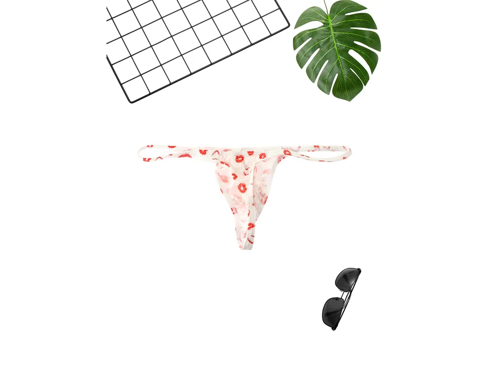 Back view of the white men's thong with red lip print.